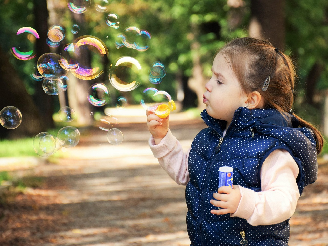 A kid is playing in the Rainbow Play school