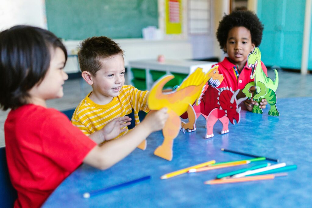 Role of Play in child development with kids engaging in creative drawing and coloring activities